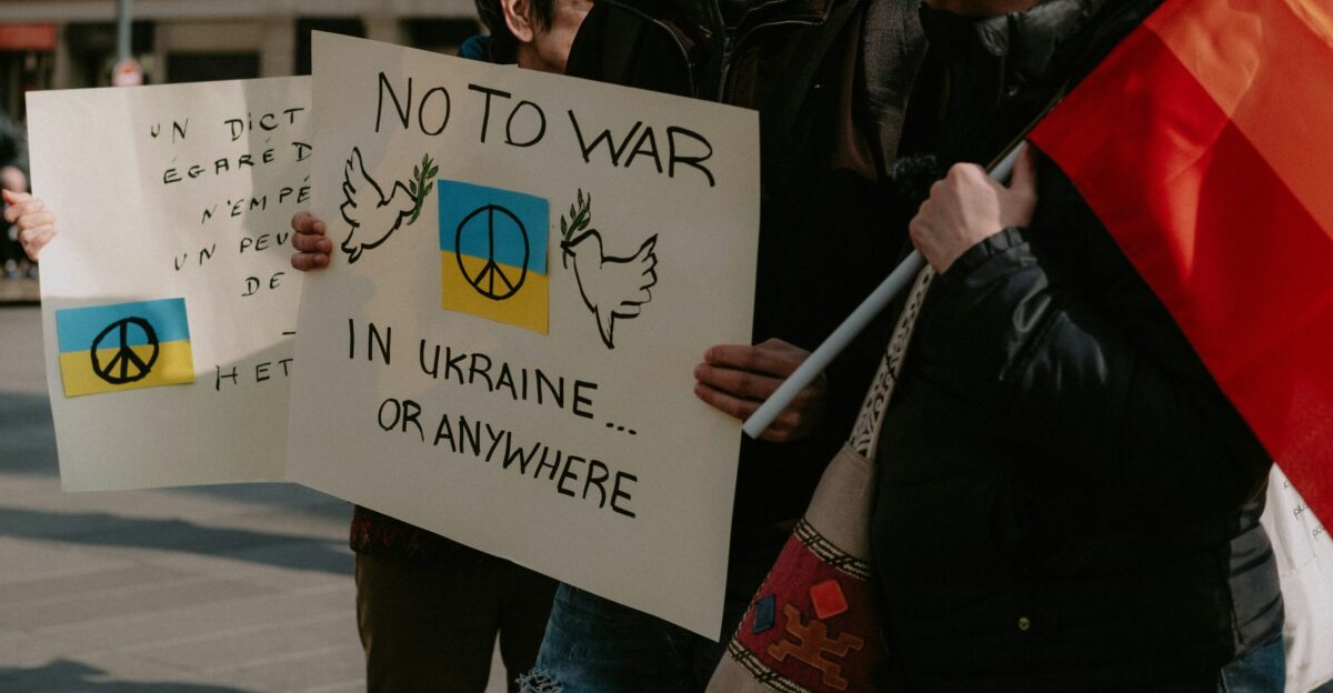 a group of people holding signs and flags
