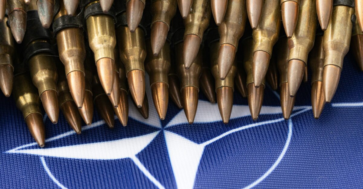a bunch of bullet like objects on a blue background