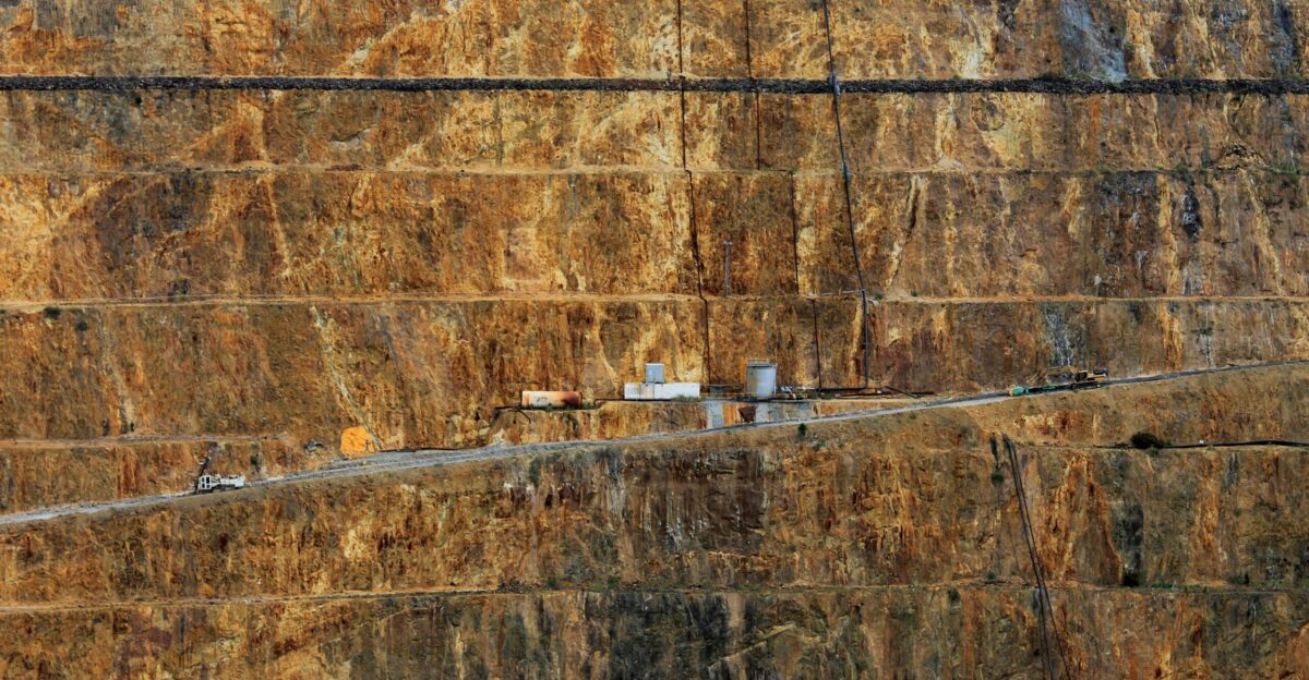 a very long road going through a huge mountain