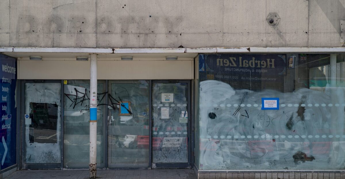 a store front with graffiti on the windows
