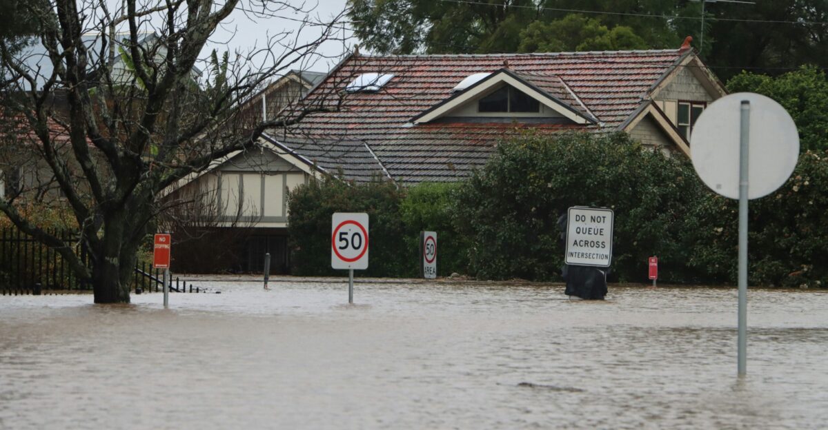 a house with a sign in front of it