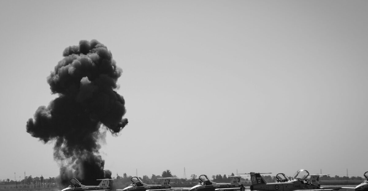 a group of planes on a runway