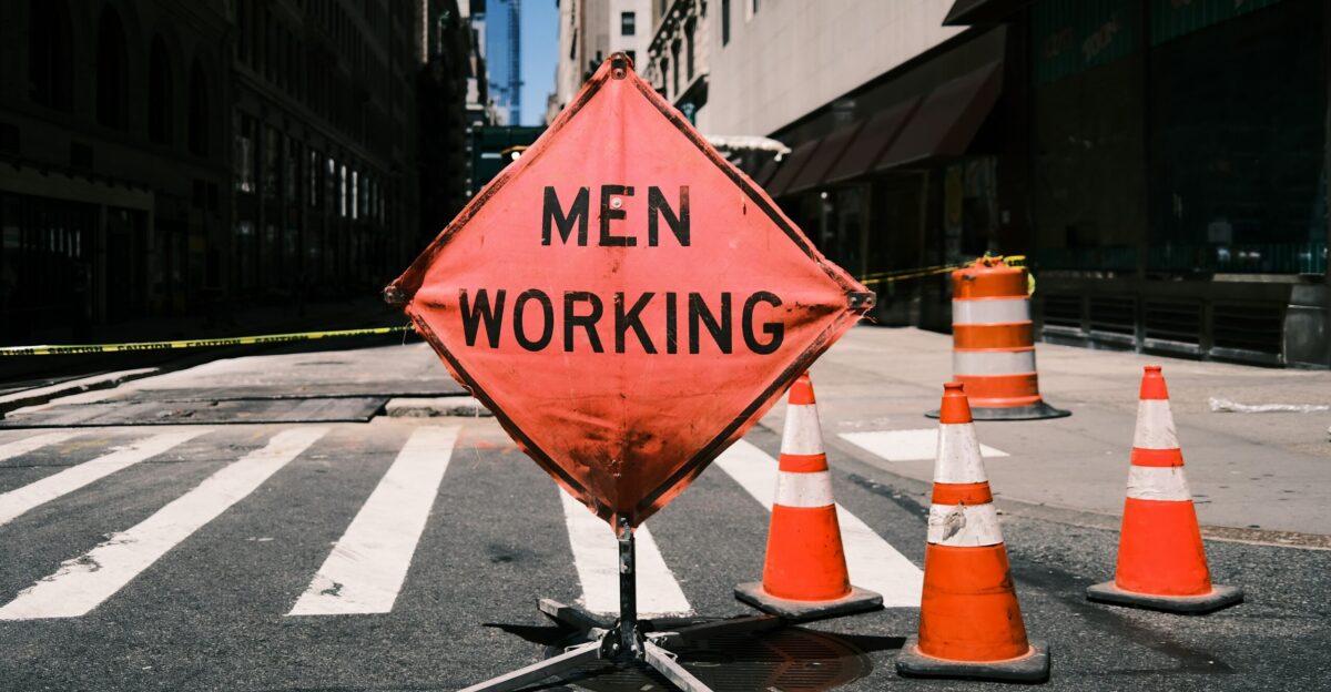 a road sign is posted on the side of a road