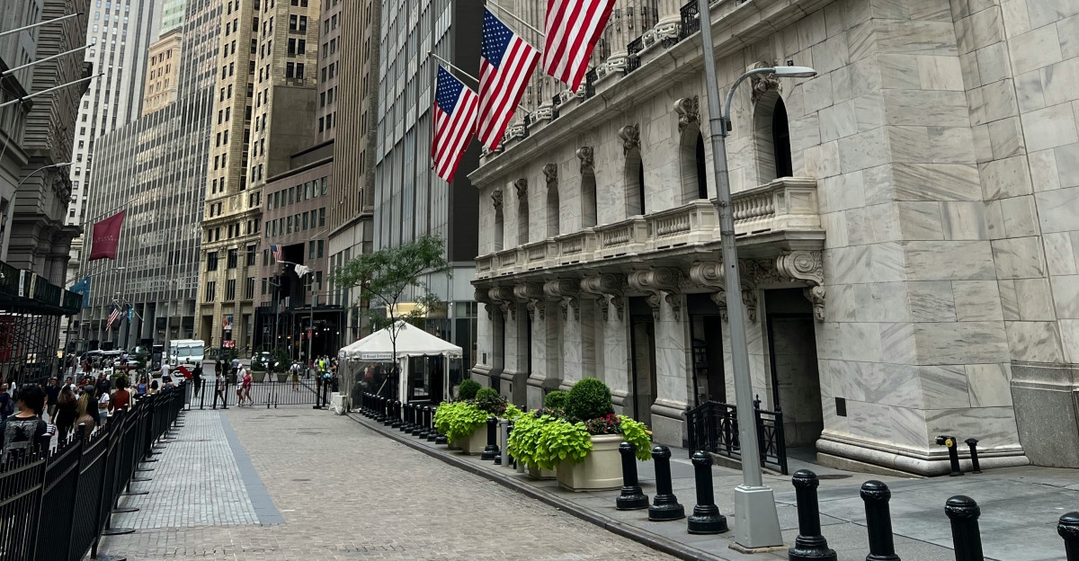 a street with buildings and flags