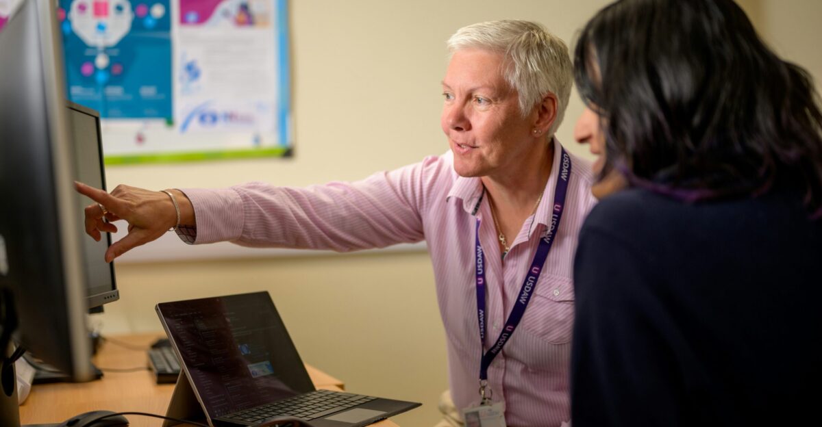 a man pointing at a woman