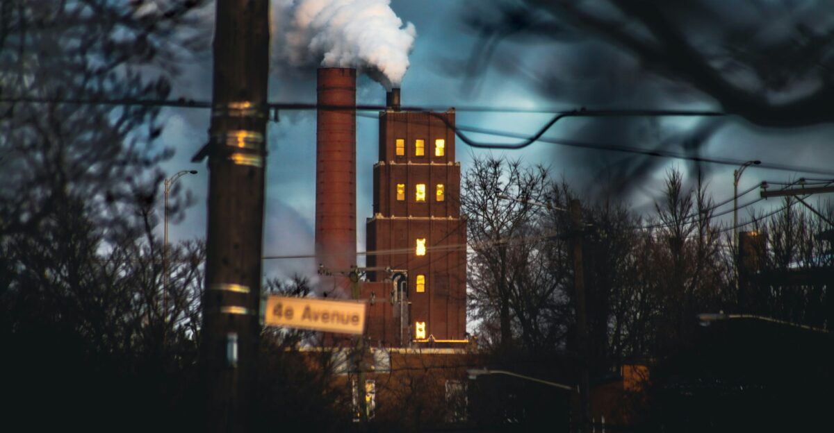 a factory with smoke coming out of it s stacks