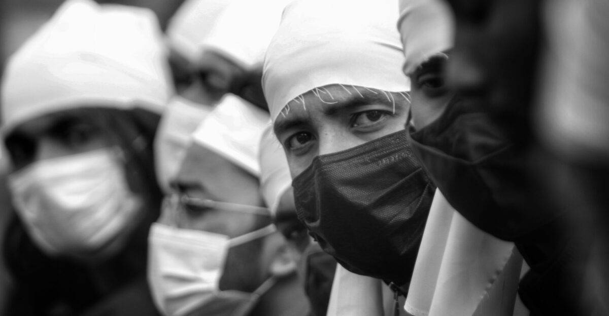 a group of people wearing surgical masks
