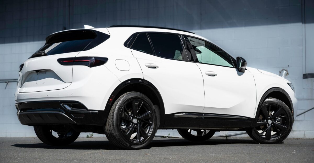 a white car parked in front of a building
