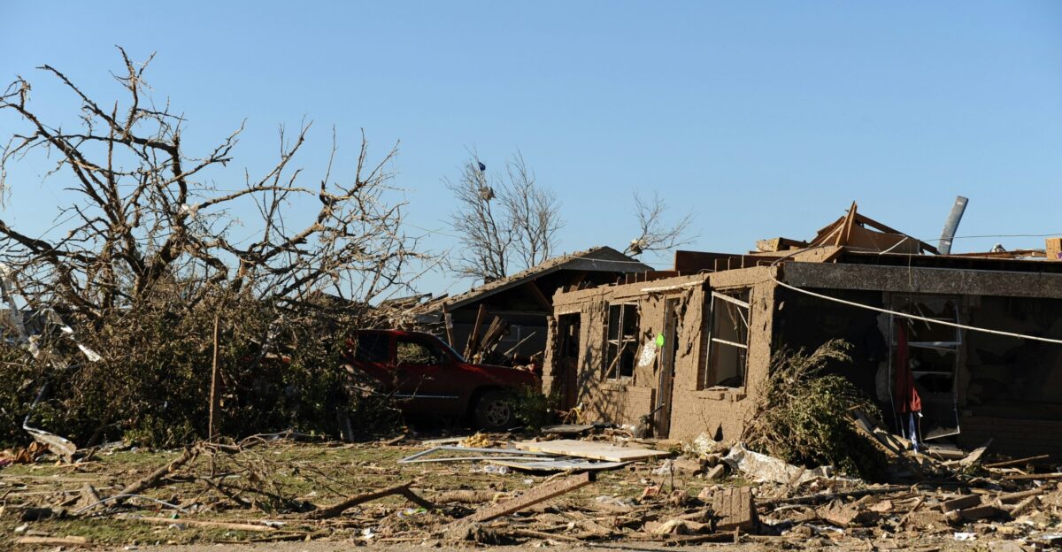 a house that has been destroyed by a tree