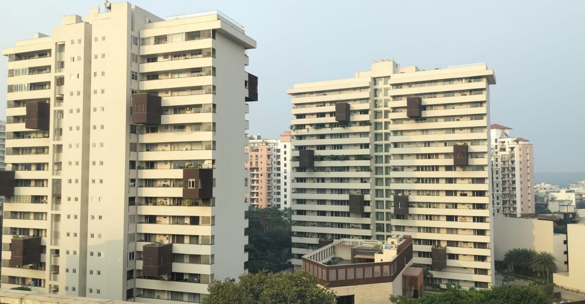 a couple of tall buildings sitting next to each other