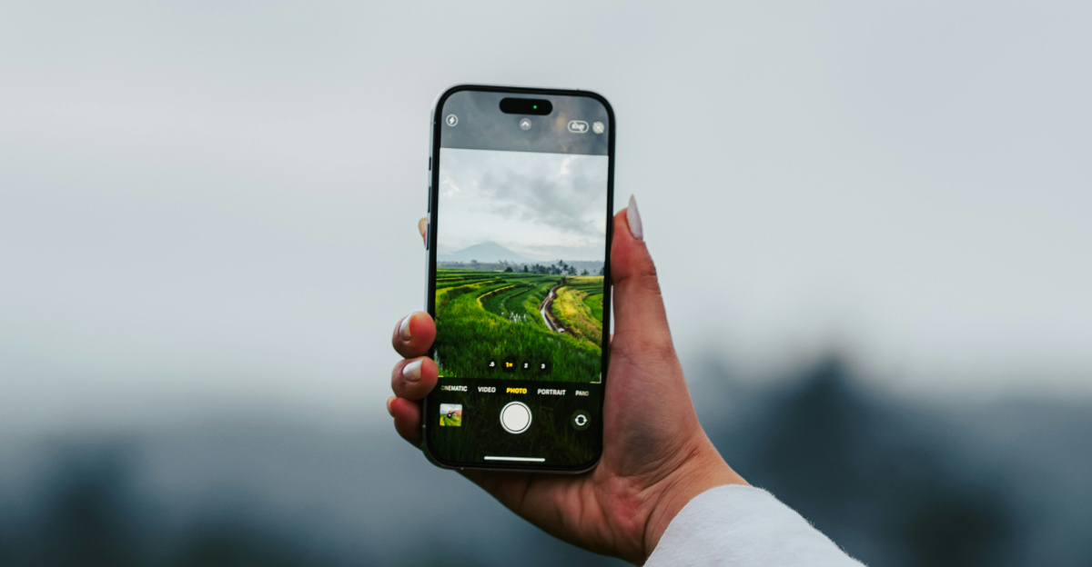 a woman taking a picture with her cell phone