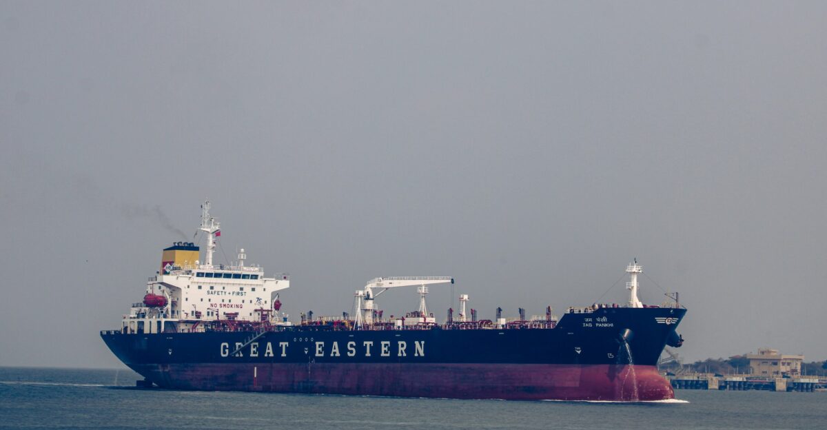 a large cargo ship in the middle of the ocean