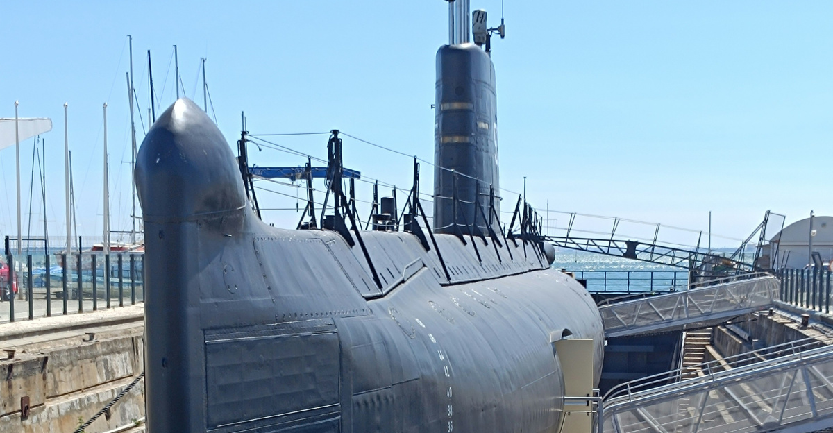 A submarine sitting on top of a wooden dock