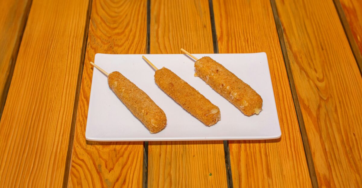 Three pieces of food sitting on top of a white paper