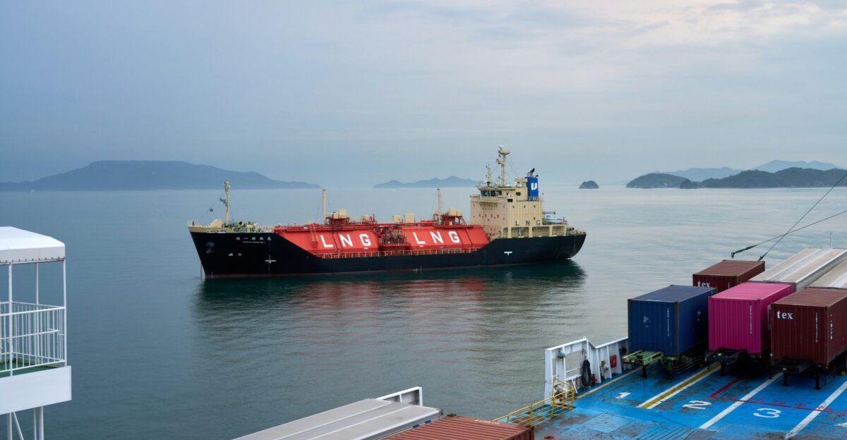 A large boat in the water near a dock