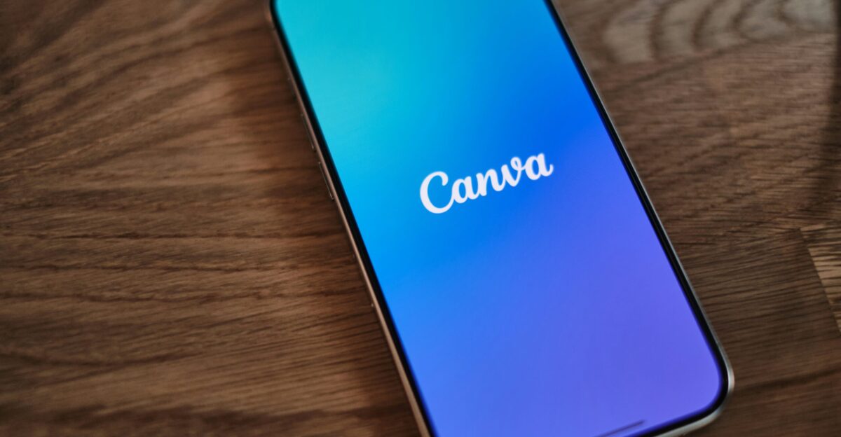 A cell phone sitting on top of a wooden table