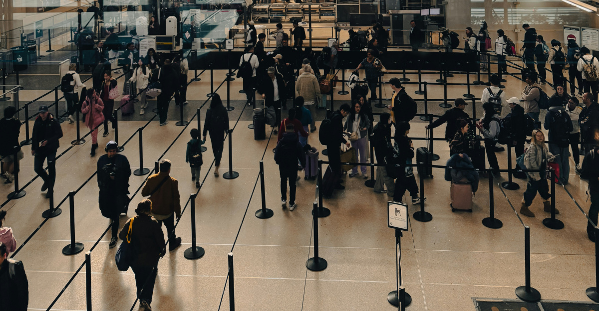 A large group of people walking around a building