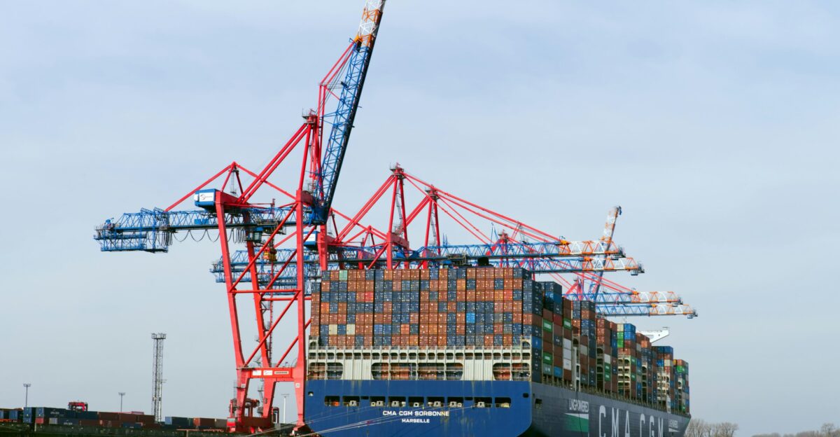 Cargo ship being loaded with containers at the port