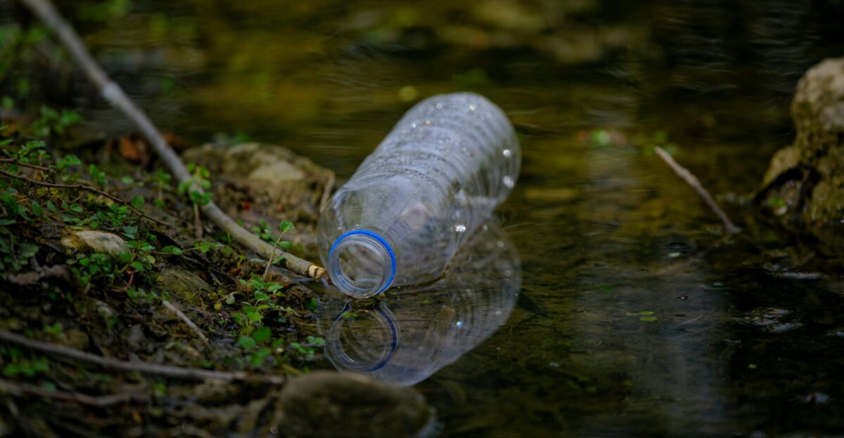 Plastic bottle polluting a body of water