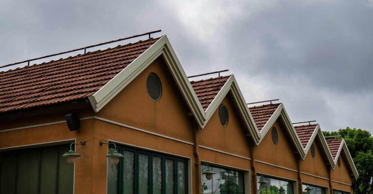 A row of buildings has a sawtooth roof