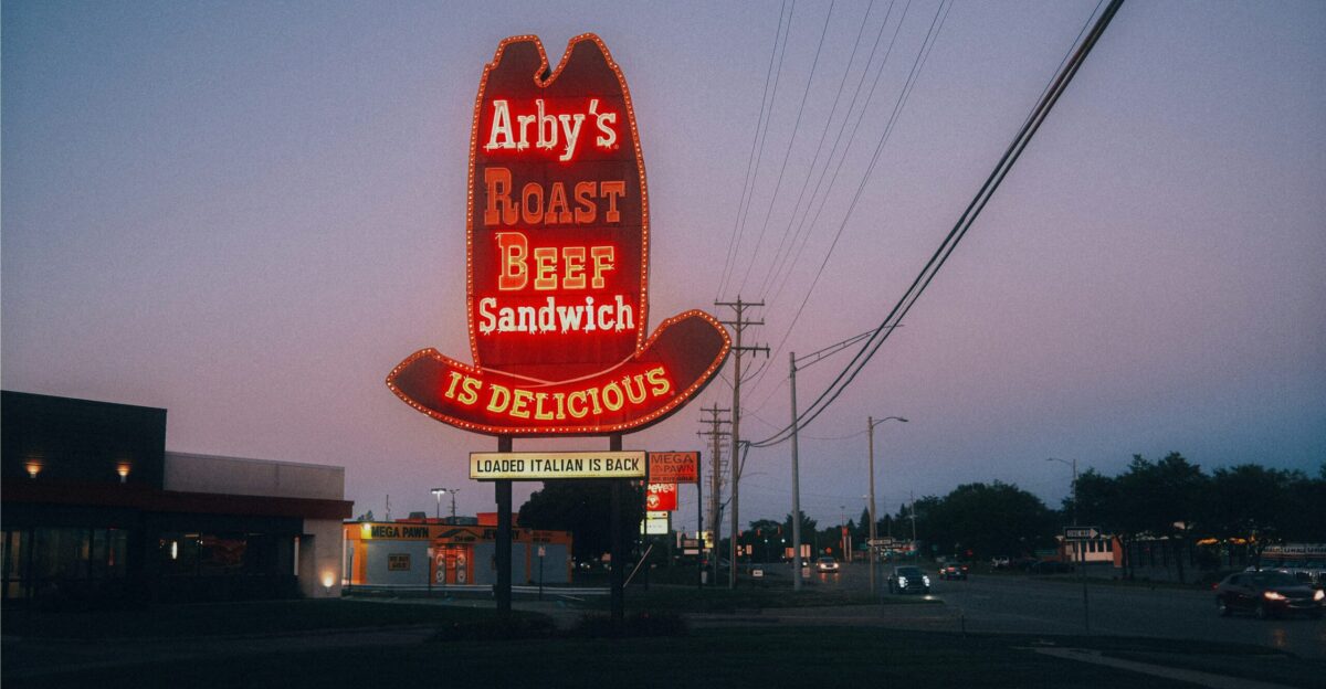 Arby s roast beef sandwich sign at dusk