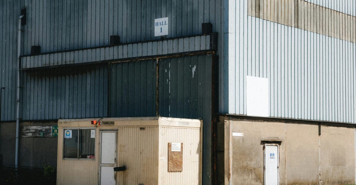 Small security booth next to industrial building