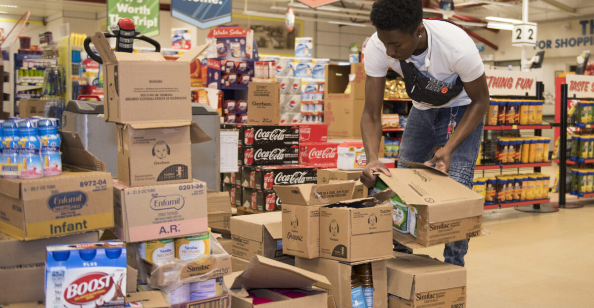 RAF Alconbury and RAF Molesworth employees and volunteers restock shelves at the base commissary at RAF Alconbury England March 16 2020 Volunteers answered the call to support the community to ensure service members and their families had access to essential items amid COVID-19 U S Air Force photo by Airman 1st Class Jennifer Zima