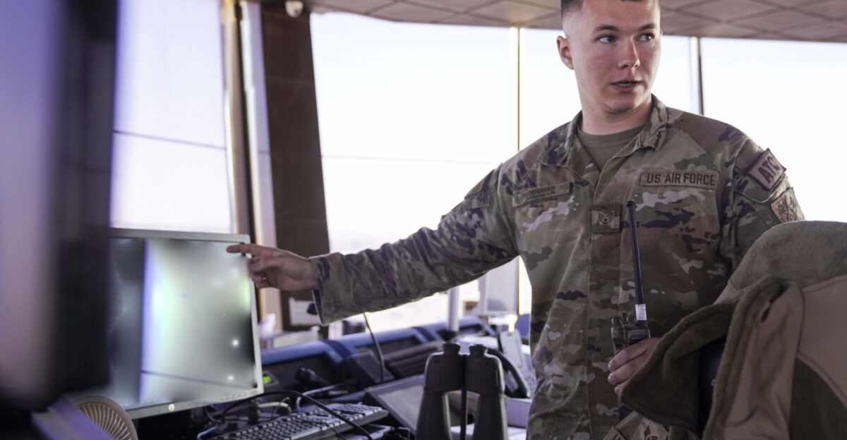 A watch supervisor assigned to the 378th Expeditionary Operations Support Squadron demonstrates equipment used to monitor air traffic in an air traffic control tower within the U S Central Command area of responsibility Jan 6 2025 Air traffic controllers rely on tools such as binoculars radar and radios to manage and regulate airspace operations effectively U S Air Force photo