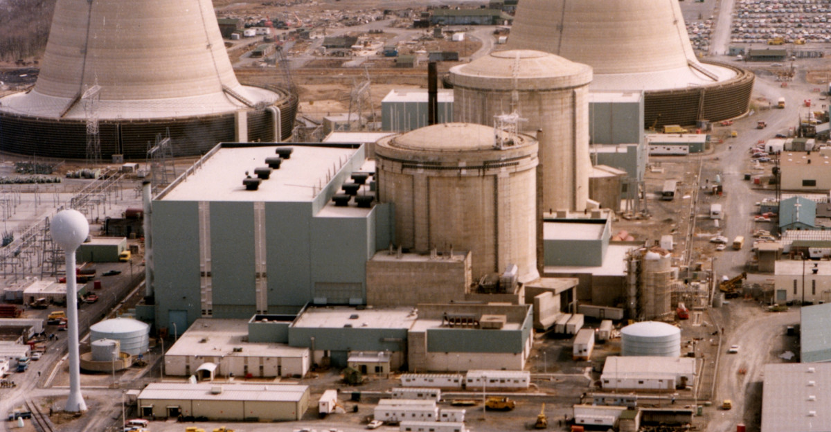 Color photograph of the Three Mile Island nuclear generating station which suffered a partial meltdown in 1979 The reactors are in the smaller domes with rounded tops the large smokestacks are just cooling towers