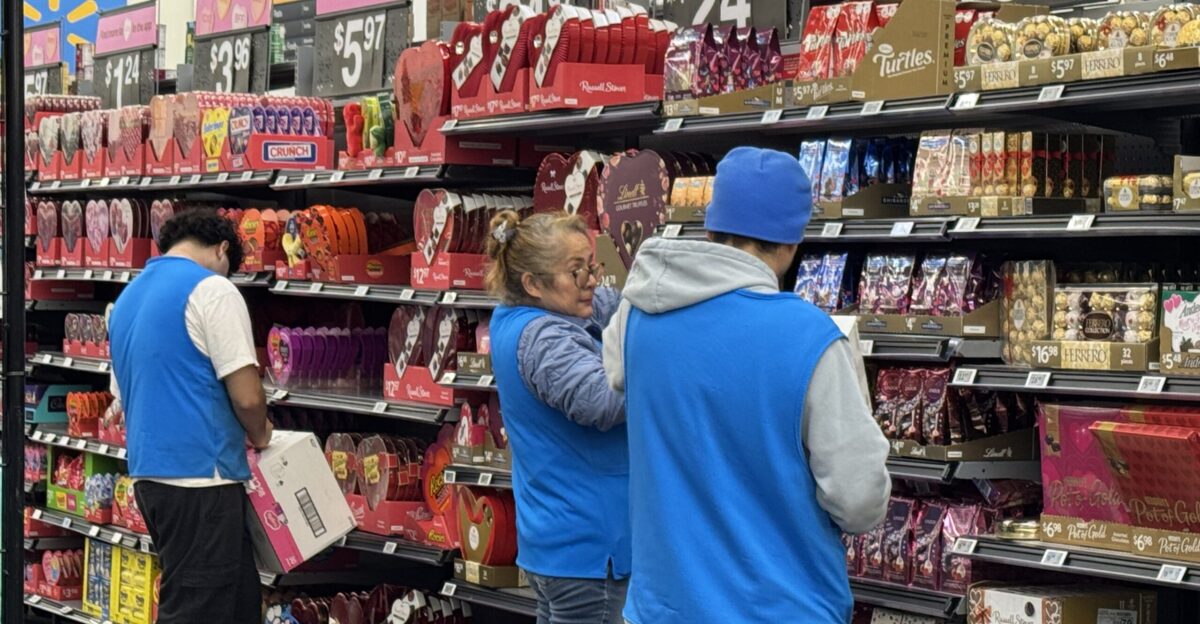 Workers at Wal-Mart putting out Valentine s candy in Napa Calif