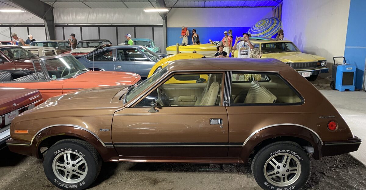 AMC Eagle Kammback two-door sedan An innovative fully automatic all-wheel-drive subcompact car built by American Motors Corporation AMC This base model version is finished in brown with a tan interior This har features the standard floor-shited four-speed transmission and the optional aluminum road wheels The Kammback sedan is one of two small models the second being the sporty Eagle SX 4 based on the Spirit liftback that debuted for the 1980 model year as the Eagle Series 50 Photographed at the Rambler Ranch collection located at 36370 Forest Trail Elizabeth CO 80107 - see - that was part of the 2021 American Motors Owners AMO convention held in Colorado Springs Colorado