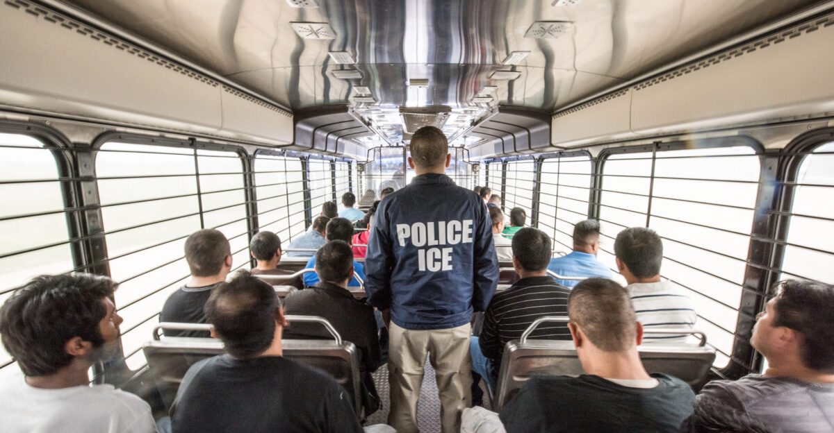 An ERO officer escorts aliens headed to an ICE detention facility in Chicago Ill