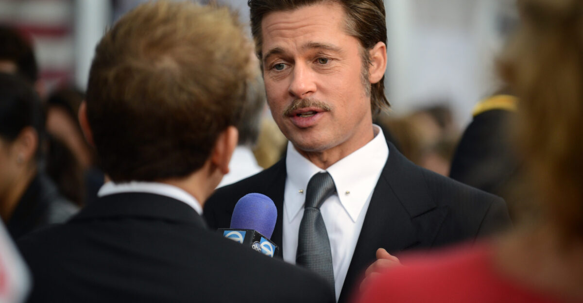 Actor Brad Pitt the star of the movie who plays the part of Wardaddy Don Collier gives interviews with the media on the Red Carpet during the world premiere of the movie Fury at the Newseum in Washington D C Department of Defense photo by Marvin Lynchard