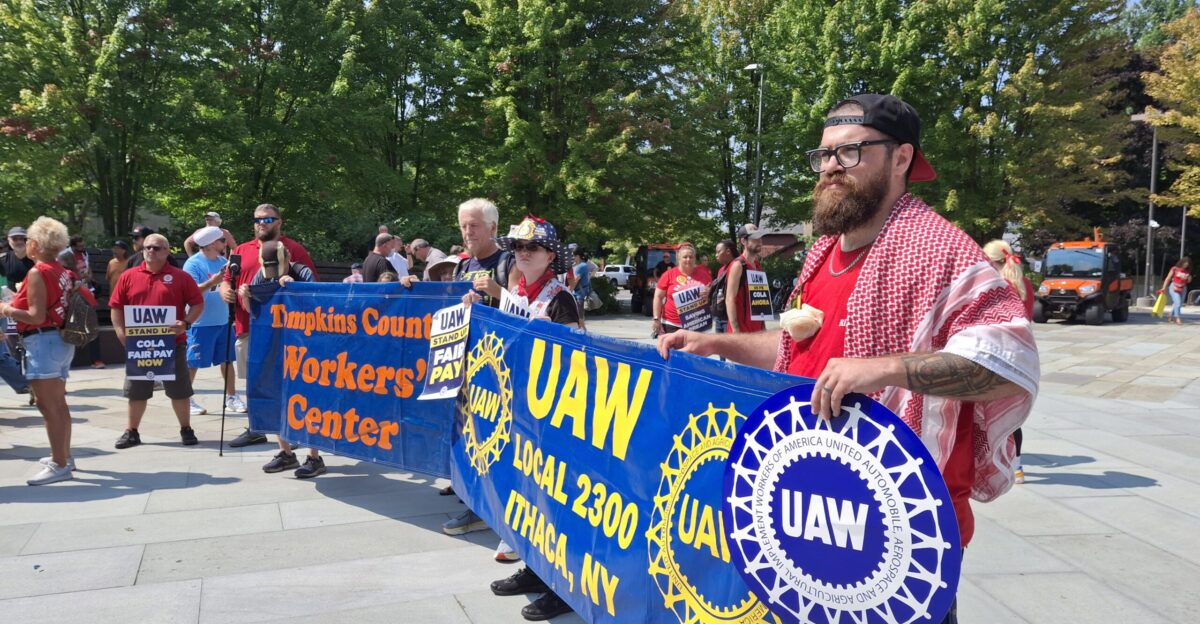 People holding banners at a union rally This image was taken at a rally on August 16 2024 as UAW Local 2300 was in the middle of contract negotiations with Cornell University