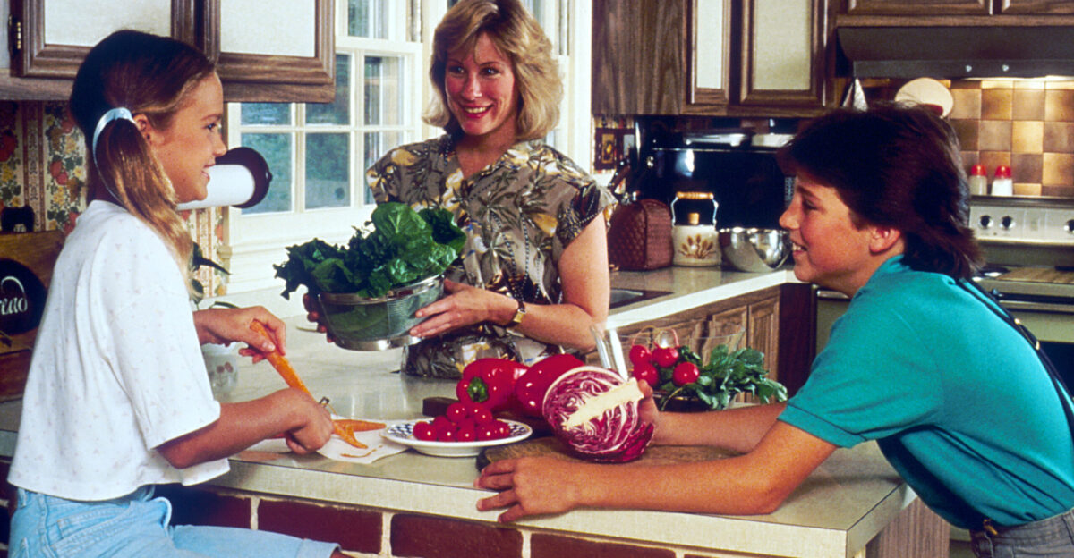 Title Family in a Kitchen Description A Caucasian woman boy and girl sit at a kitchen counter preparing vegetables Topics Categories Food and Drink People - Family Friends Type Color Photo Source National Cancer Institute