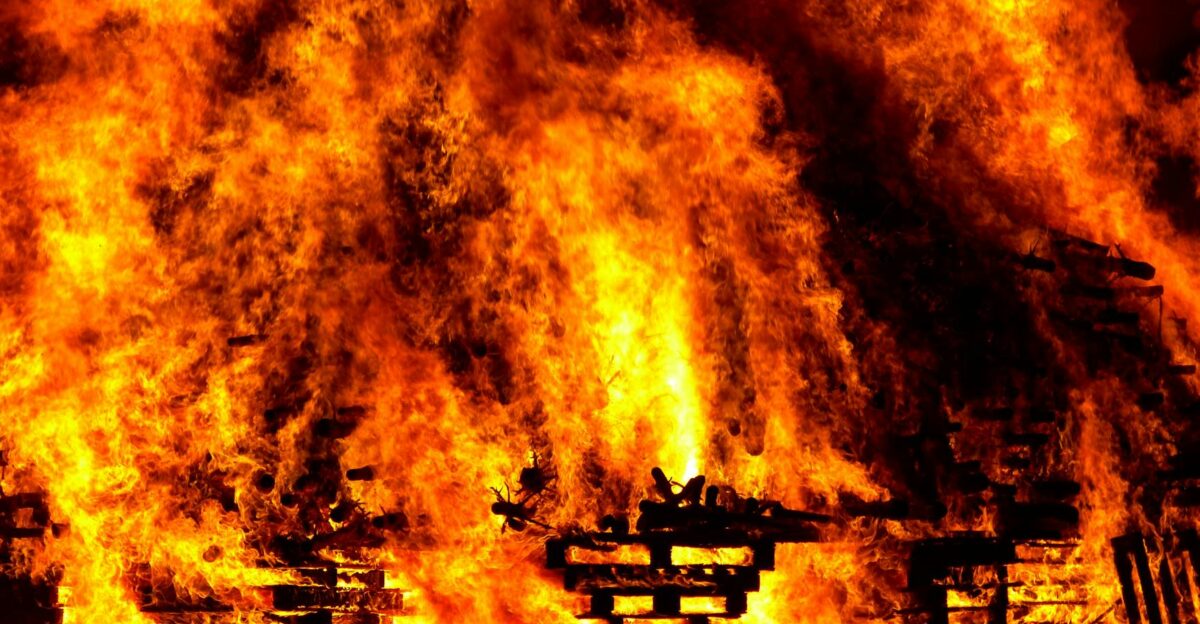 Intense flames engulf wooden pallets in a breathtaking display of fire and heat