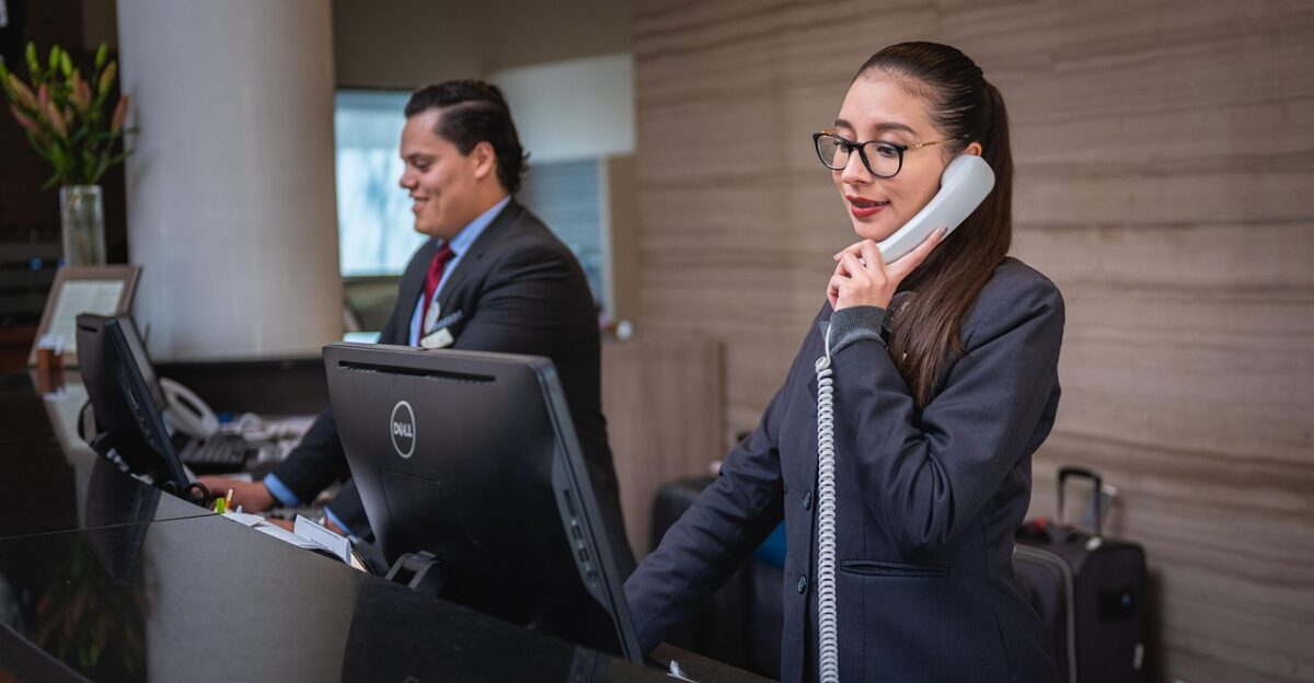 receptionists phone call hotel reception woman man work attention lobby employees professional company assistance hotel hotel hotel hotel hotel reception