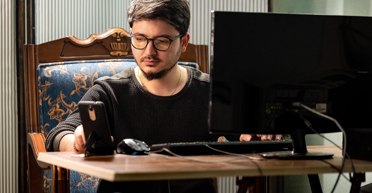 male internet freelancer device adult online person entrepreneur technology forward using browsing man working computer network laptop learning laughing workplace job wireless looking desk connected