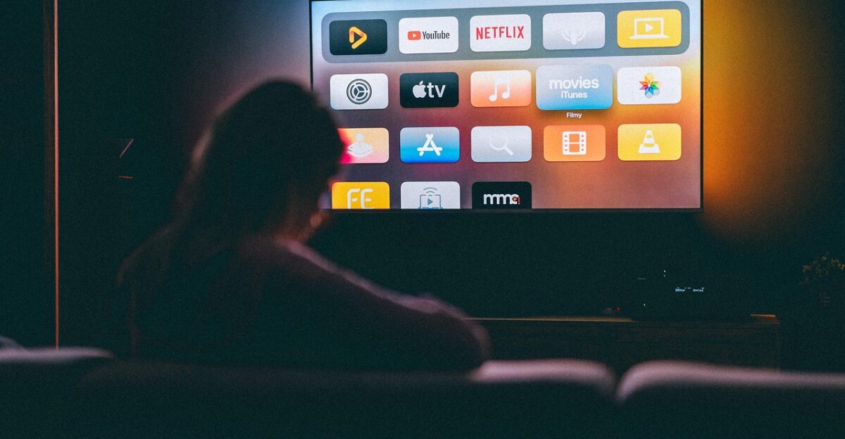 applications tv watching girl woman television dark room screen youtube netflix apple tv entertainment recreation movies series netflix netflix netflix netflix netflix