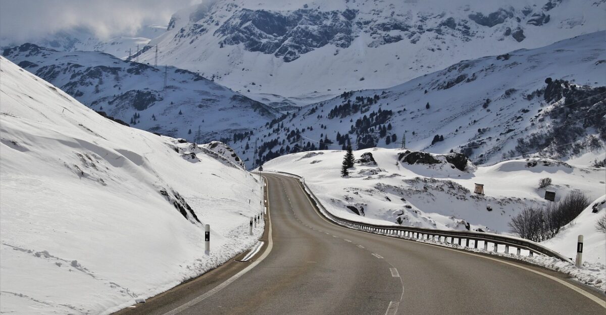winter perspective road mountain overlap the alps the height of the asphalt top snow mountains alpine nature travel switzerland high array highway distant view julierpass panoramic white the cold season on the way winter dream