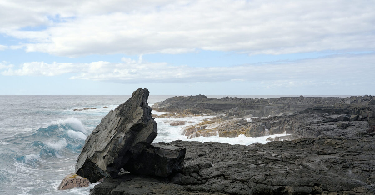 The Pacific Ocean meets a lava flow from 1969-1974 near pua Point in Hawai i Volcanoes National Park