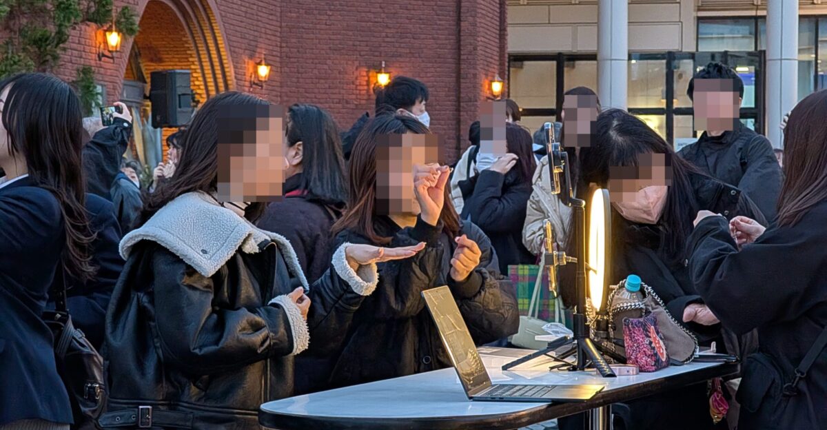 Notice the high narrow table designed to help social media posters set up their smartphones and fix their make-up There were a dozen such tables disposed around the Christmas tree