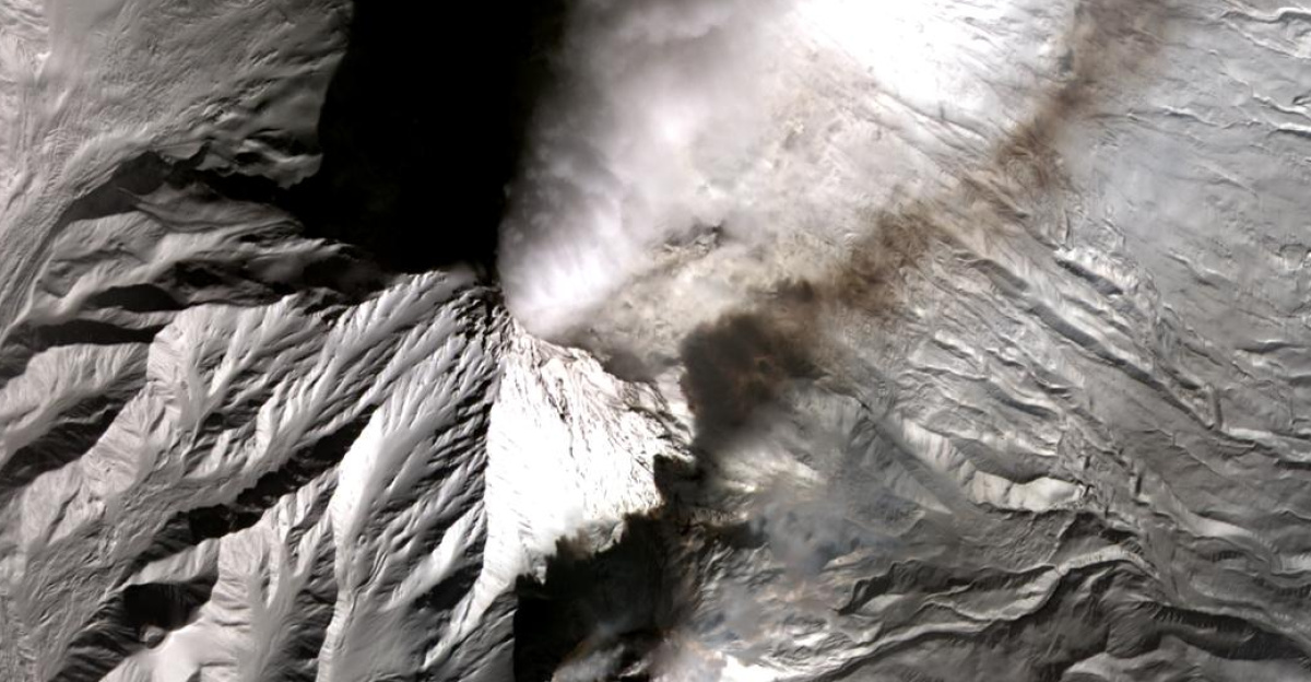 Kliuchevskoi is Kamchatka's highest (4,835 m) and most active volcano. The Russian stratovolcano produces frequent moderate-volume explosive and effusive eruptions, often producing large eruption plumes. These plumes pose a serious risk to air traffic, and are constantly monitored by the Alaska Volcano Observatory. In mid-February, lava flows were erupted on the NW flank of the volcano, melting part of the Ehrman glacier, and producing mudflows. In this ASTER image acquired February 24, the hot lava flows are picked up in the thermal infrared bands, The eruptive plume extends to the northeast. At the same time, a plume can be seen coming from Shiveluch volcano located about 10 km to the southwest. And finally, the lava dome atop Bezymianny volcano (lower center) shows several hot pixels, and a weak gas and ash plume. The scene covers an area of 26 x 25.3 km, and is centered near 56 degrees north latitude, 160.6 degrees east longitude.