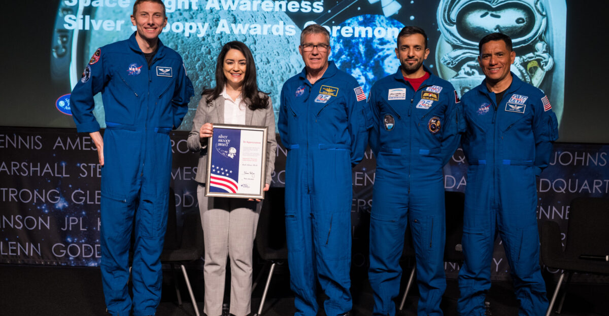 NASA astronauts Warren Hoburg and Stephen Bowen UAE United Arab Emirates astronaut Sultan Alneyadi and NASA astronaut Frank Rubio pose for a photo after presenting Dr Ruth Siboni with the Silver Snoopy Award Tuesday March 19 2024 at the Mary W Jackson NASA Headquarters building in Washington Bowen Hoburg and Alneyadi spent 186 days aboard the International Space Station as part of Expedition 69 while Rubio set a new record for the longest single spaceflight by a U S astronaut spending 371 days in orbit on an extended mission spanning Expeditions 68 and 69 Photo Credit NASA Aubrey Gemignani