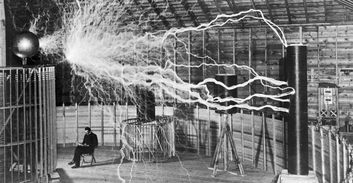 Famous photograph of Serbian-American inventor Nikola Tesla in his laboratory in Colorado Springs December 1899 supposedly sitting reading next to his giant magnifying transmitter high voltage generator while the machine produced huge bolts of electricity The photo was a promotional stunt by photographer Dickenson V Alley a double exposure First the machine s huge sparks were photographed in the darkened room then the photographic plate was exposed again with the machine off and Tesla sitting in the chair In his Colorado Springs Notes Tesla admitted that the photo is false Of course the discharge was not playing when the experimenter was photographed as might be imagined Tesla s biographers Carl Willis and Mark Seifer confirm this During 1899-1900 Tesla built this laboratory and researched wireless transmission of electric power there The Magnifying Transmitter one of the largest Tesla coils ever built with input power of 300 kW could produce potentials of around 12 million volts at a frequency of about 150 kHz creating 130 ft 41 m lightning bolts The arcs in the image are 22 feet long These long arcs were not a feature of the normal operation of the coil because they wasted energy for these photos Tesla forced the machine to produce arcs by switching the power rapidly on and off The photo was part of a publicity spread taken by photographer Dickinson Alley in December 1899 to accompany Tesla s magazine article Nikola Tesla The Problem of Increasing Human Energy Century Magazine The Century Co New York June 1900 fig 8 a version without Tesla appears in the article Wellcome Images Keywords Electrical energy Electric Power Electricity Energy Volt Power Psychology Static Voltage Laboratories Nikola Tesla