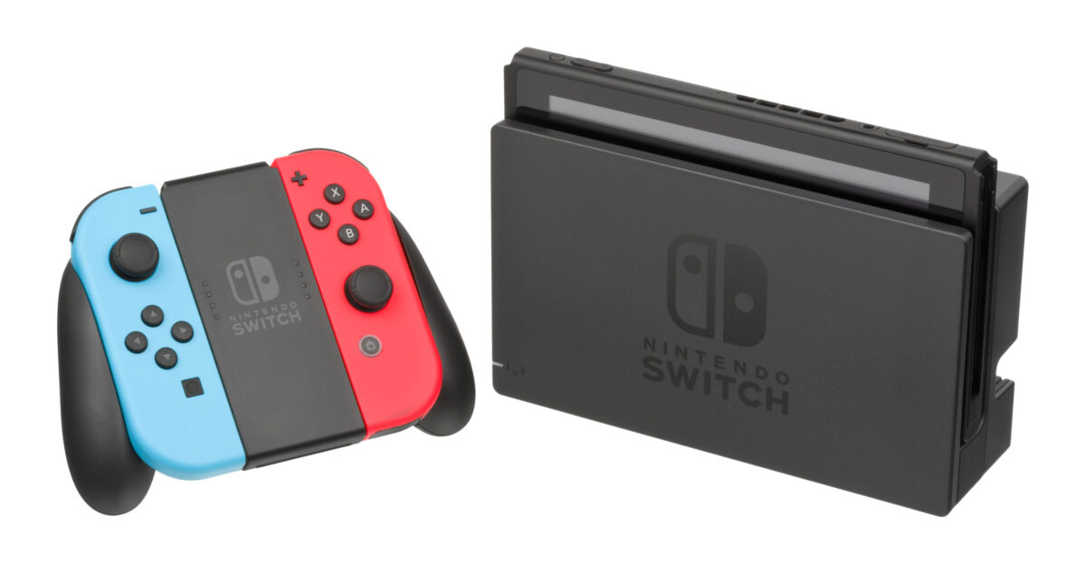 The Nintendo Switch a hybrid portable home console released by Nintendo in 2017 It is shown here in the docked home mode with the controllers detached from the main unit and in the included grip