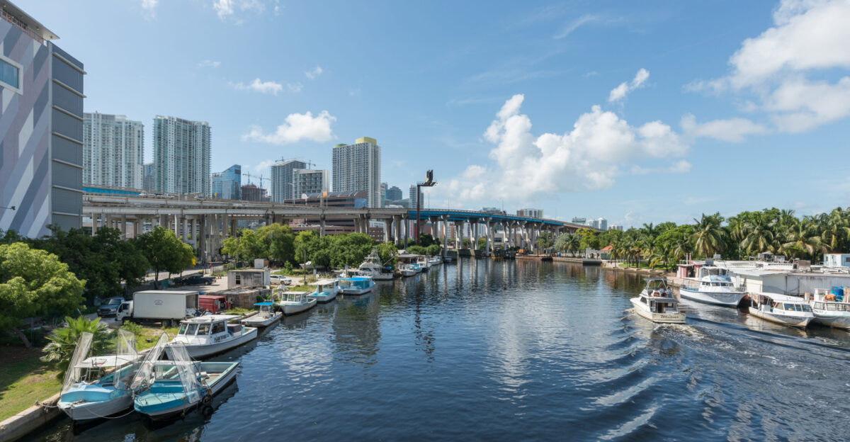 A north view of Miami and the Miami River as seen from a bridge carrying 1st St