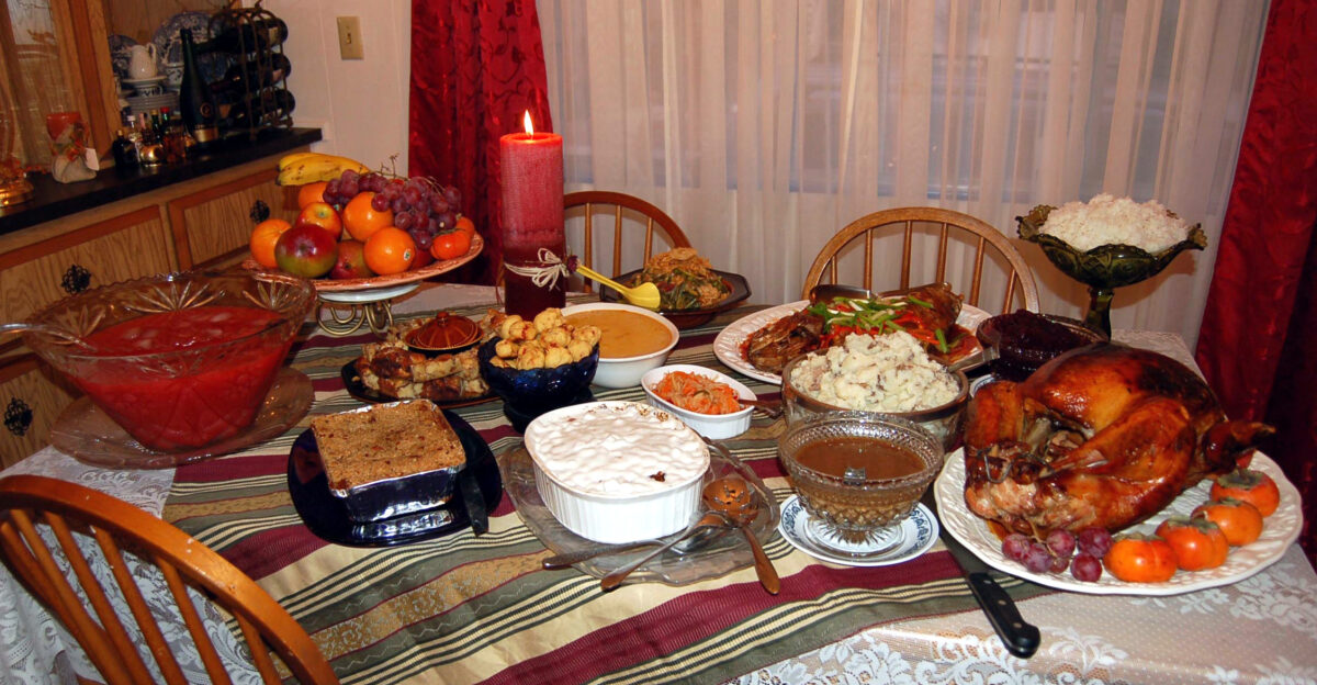 Tender juicy roast turkey - the main attraction - with old-fashioned gravy cranberry sauce smashed potatoes baked green beans sweet and sour cod steamed rice achara pickled green papaya relish leche flan pigs in a blanket apple crisp from Yucaipa punch and soda