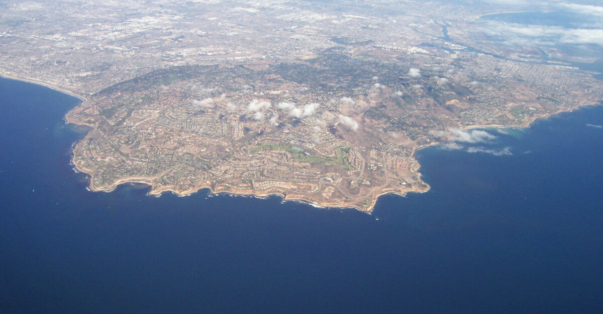 An aerial view of the Palos Verdes Peninsula and surrounding South Bay region Los Angeles County Southern California The city of Los Angeles California is seen in the distance north Santa Monica Bay on the left west and San Pedro Bay-Los Angeles Harbor on the upper-right east