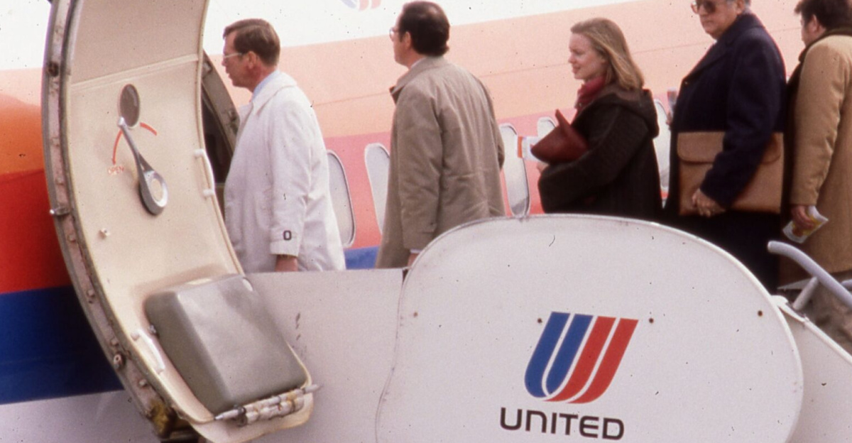 <div class="description">
People ascending a portable ladder and boarding a United Airlines plane at Port Columbus International Airport.</div>
